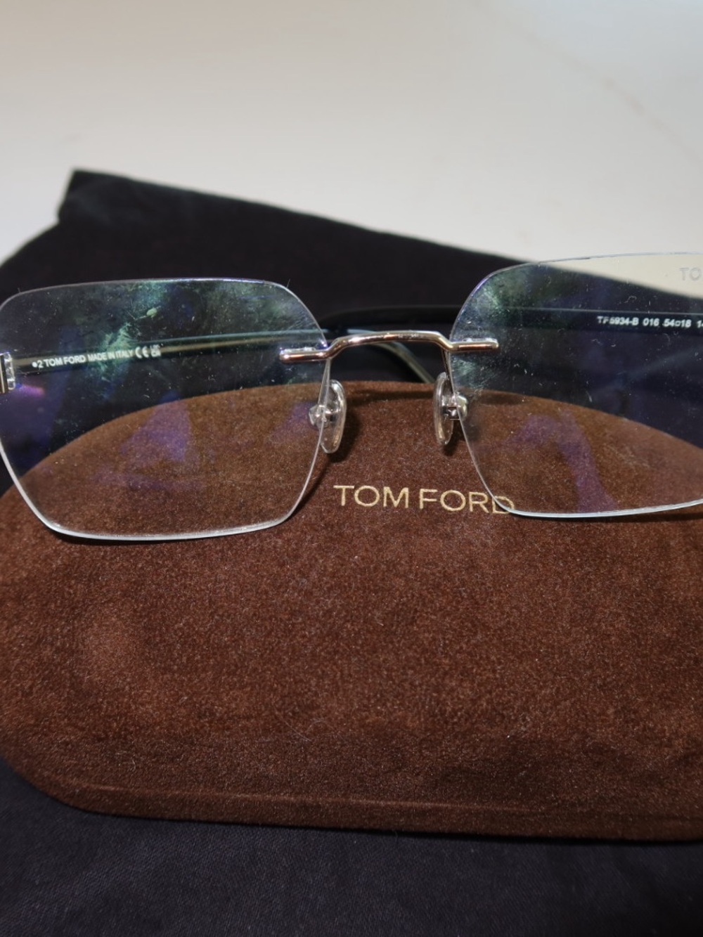 Tom Ford Rimless Eyeglasses with Silver Bridge and Clear Lenses